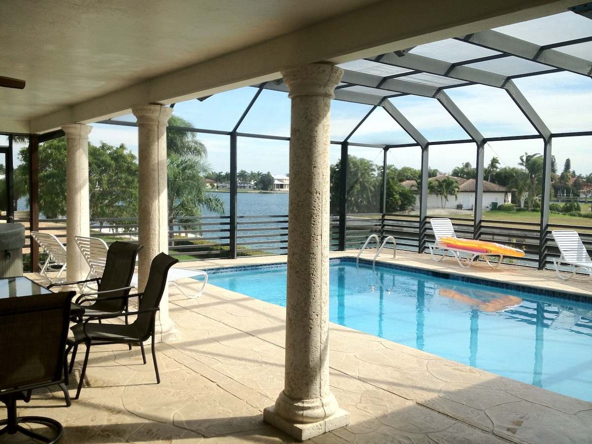 Screened lanai, heated pool, and a wide water view
