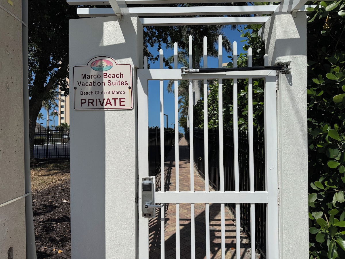 A gated entrance to Marco Beach Vacation Suites, Beach Club of Marco, marked PRIVATE.