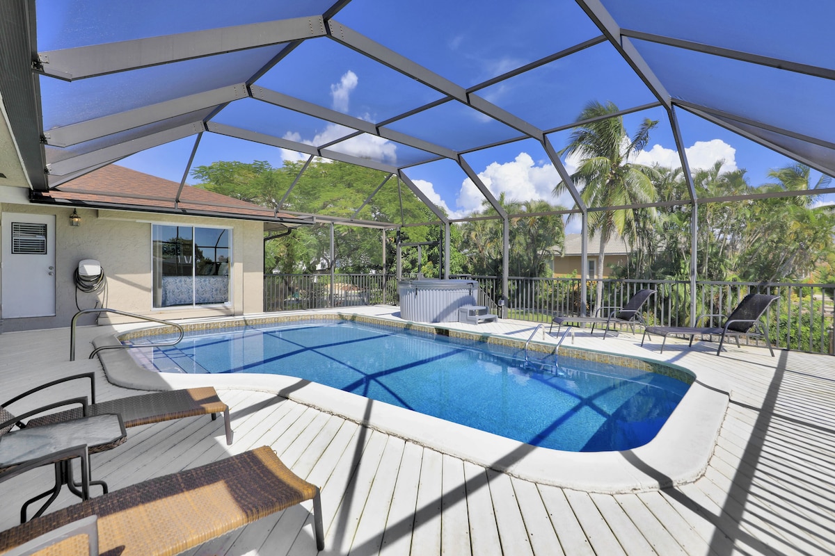 Screened pool and hot tub on a wide lanai